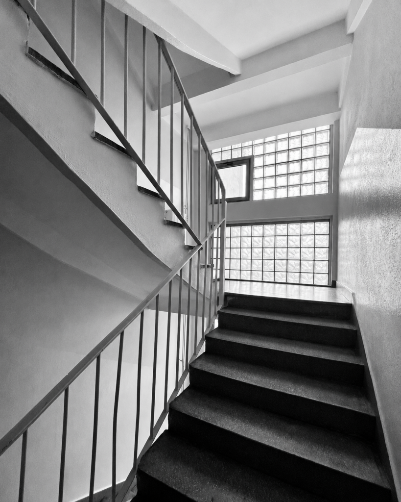 Glass-block stairwell in a 1980s residential building in Grochów, Warsaw