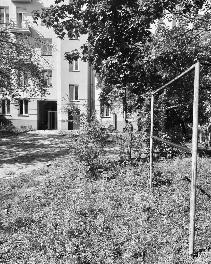 Courtyard carpet-beating frame beside a 1936 tenement in Kamionek, Warsaw