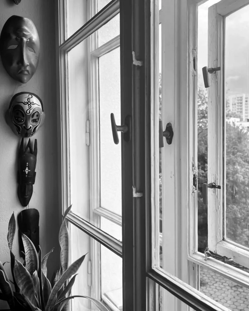 Original double-frame wooden windows in a lived-in 1936 Kamionek apartment